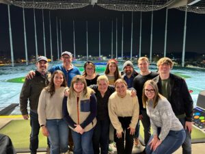 FleishmanHillard Minneapolis colleagues pose for a photo at a team golf outing